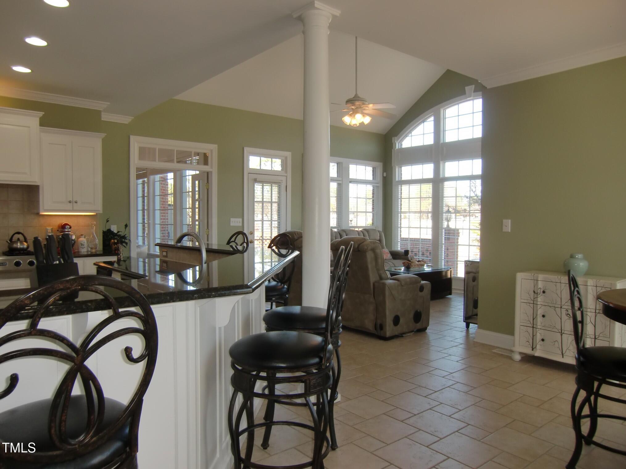 325 Sandy Ridge Road Dunn, NC 28334 - Photo 30 of 97 Kitchen blends with Sunroom to make a unique Keeping Room! Golf Course View!