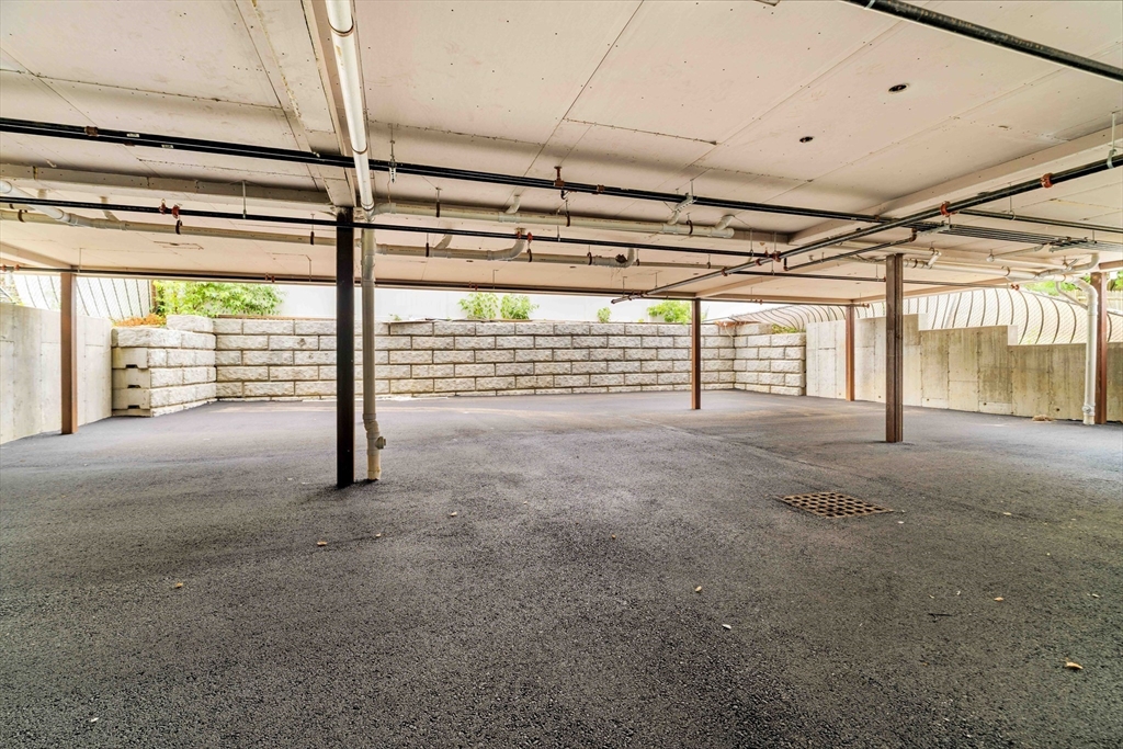 95 Addison Street, Unit A Boston, MA 02128 - Photo 11 of 12 a view of an empty room with glass door