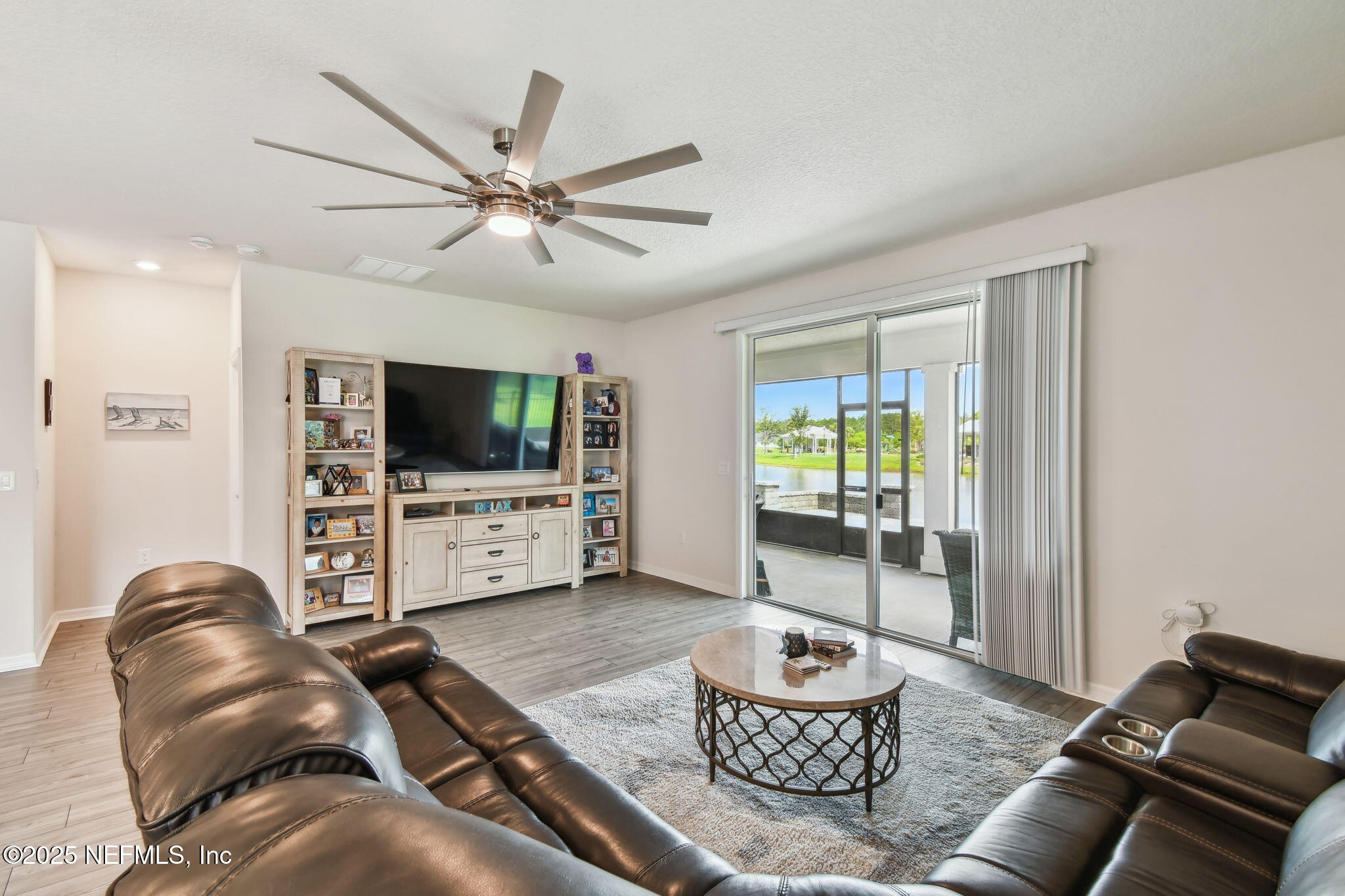 182 Myrtle Oak Court St. Augustine, FL 32092 - Photo 17 of 81 a living room with furniture and a flat screen tv