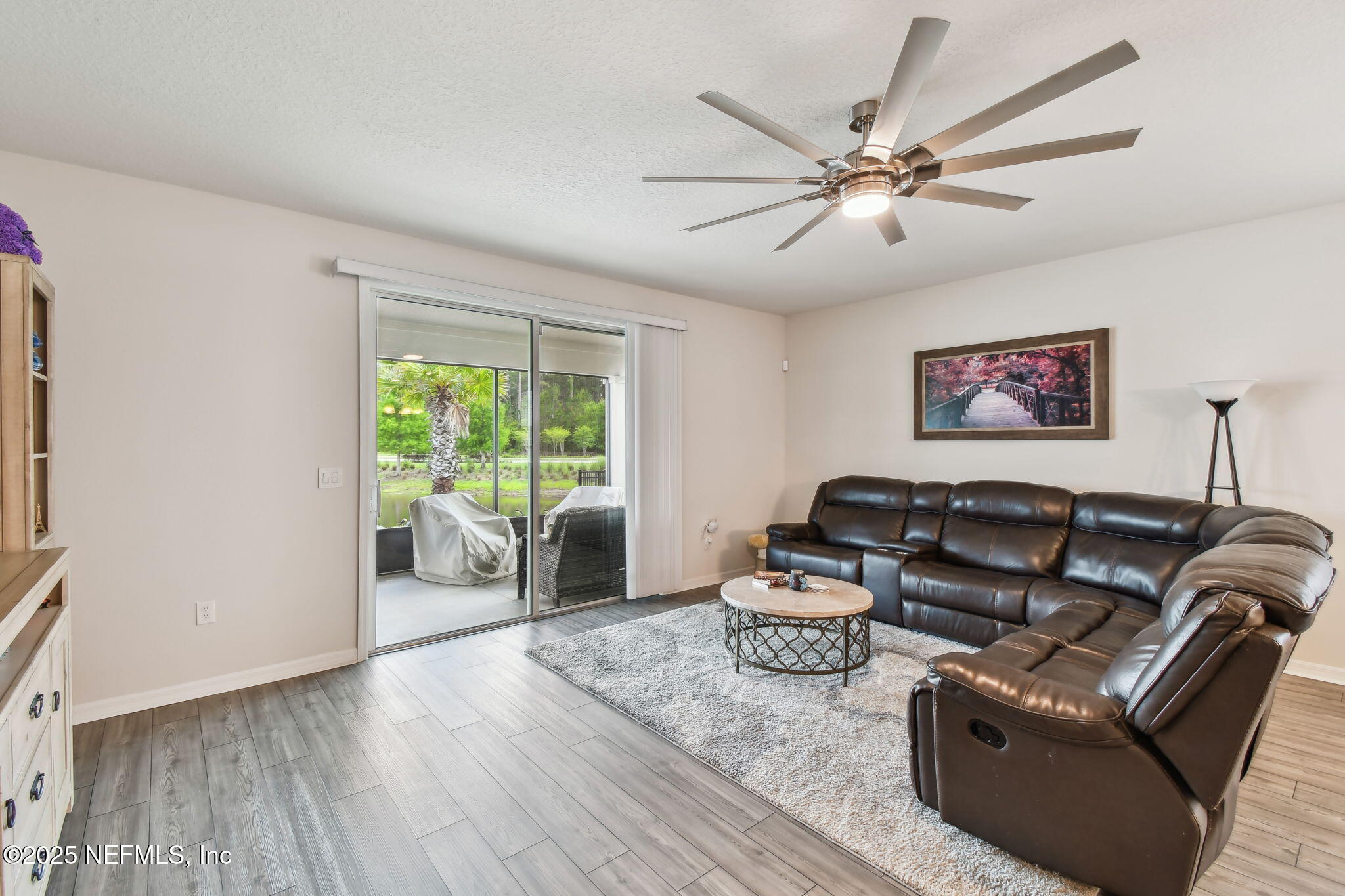 182 Myrtle Oak Court St. Augustine, FL 32092 - Photo 19 of 81 a living room with furniture and a large window
