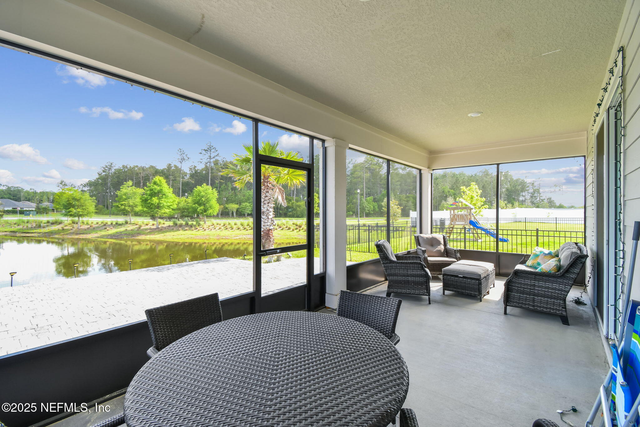 182 Myrtle Oak Court St. Augustine, FL 32092 - Photo 36 of 81 a living room with furniture and floor to ceiling windows