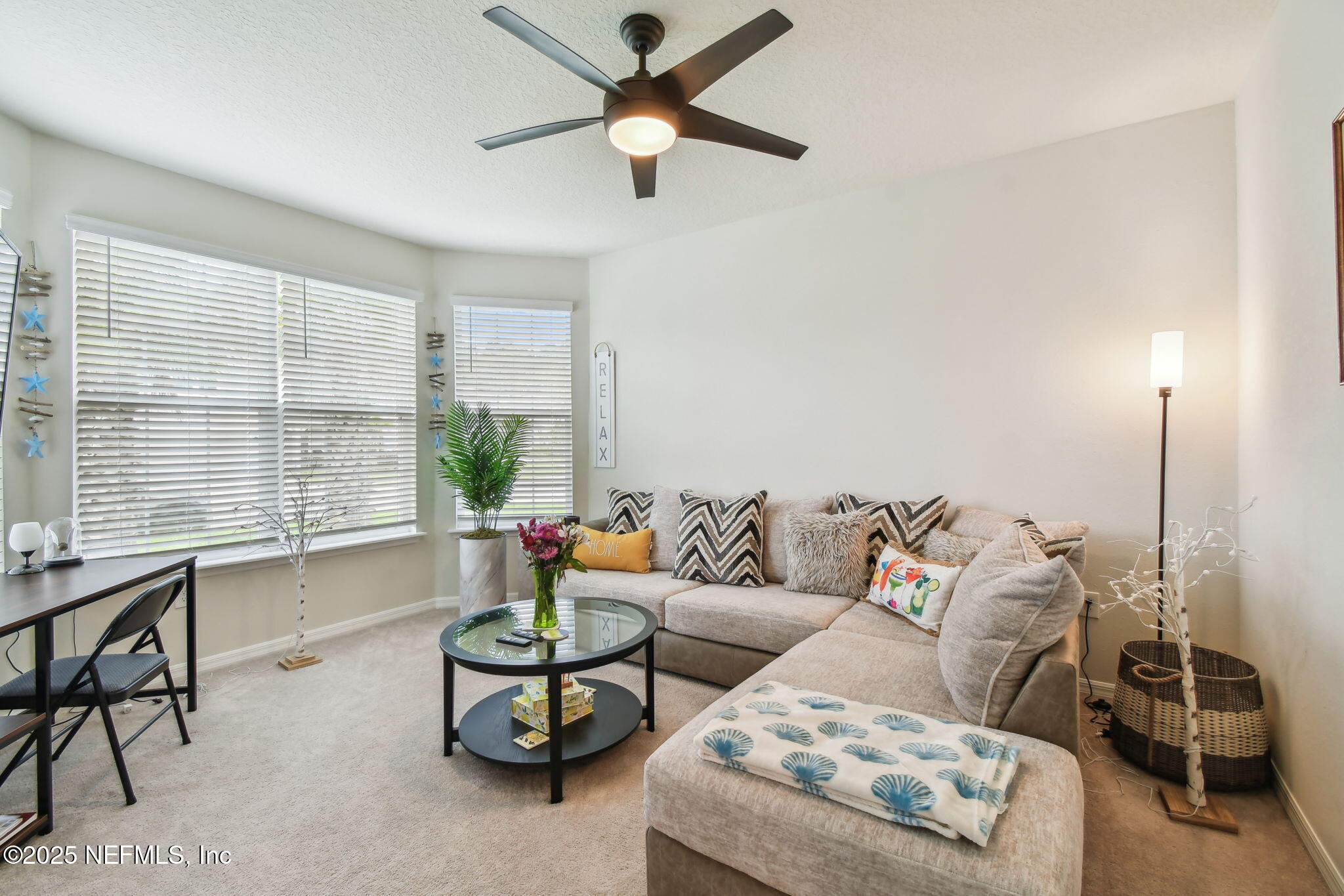 182 Myrtle Oak Court St. Augustine, FL 32092 - Photo 7 of 81 a living room with furniture and a large window