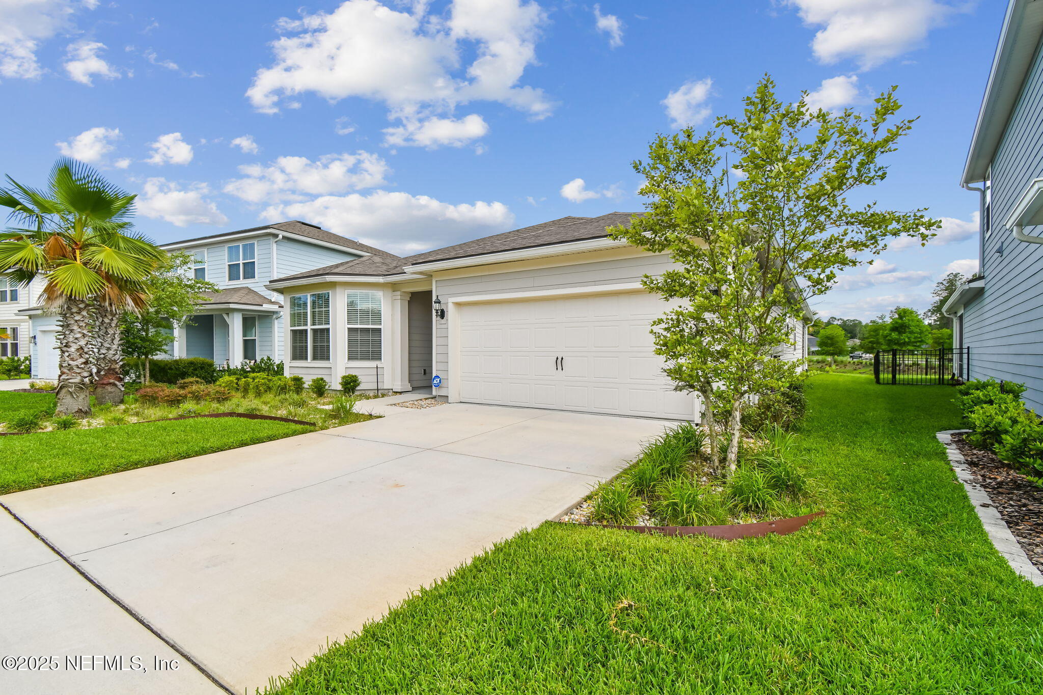 182 Myrtle Oak Court St. Augustine, FL 32092 - Photo 74 of 81 a front view of a house with a yard and garage