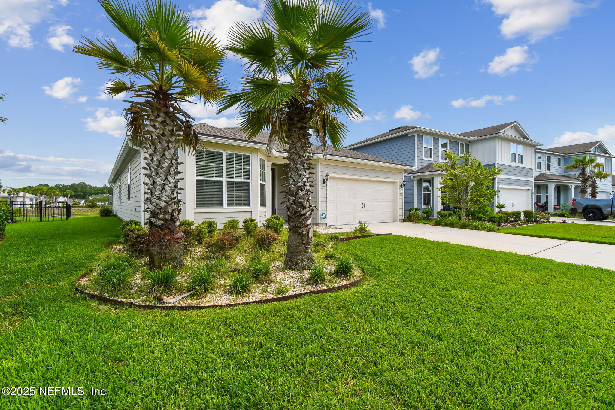 182 Myrtle Oak Court St. Augustine, FL 32092 - Photo 76 of 81 a front view of a house with a yard