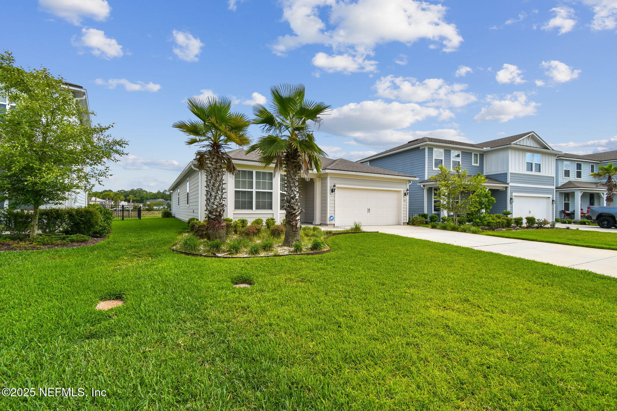 182 Myrtle Oak Court St. Augustine, FL 32092 - Photo 77 of 81 a front view of a house with a garden
