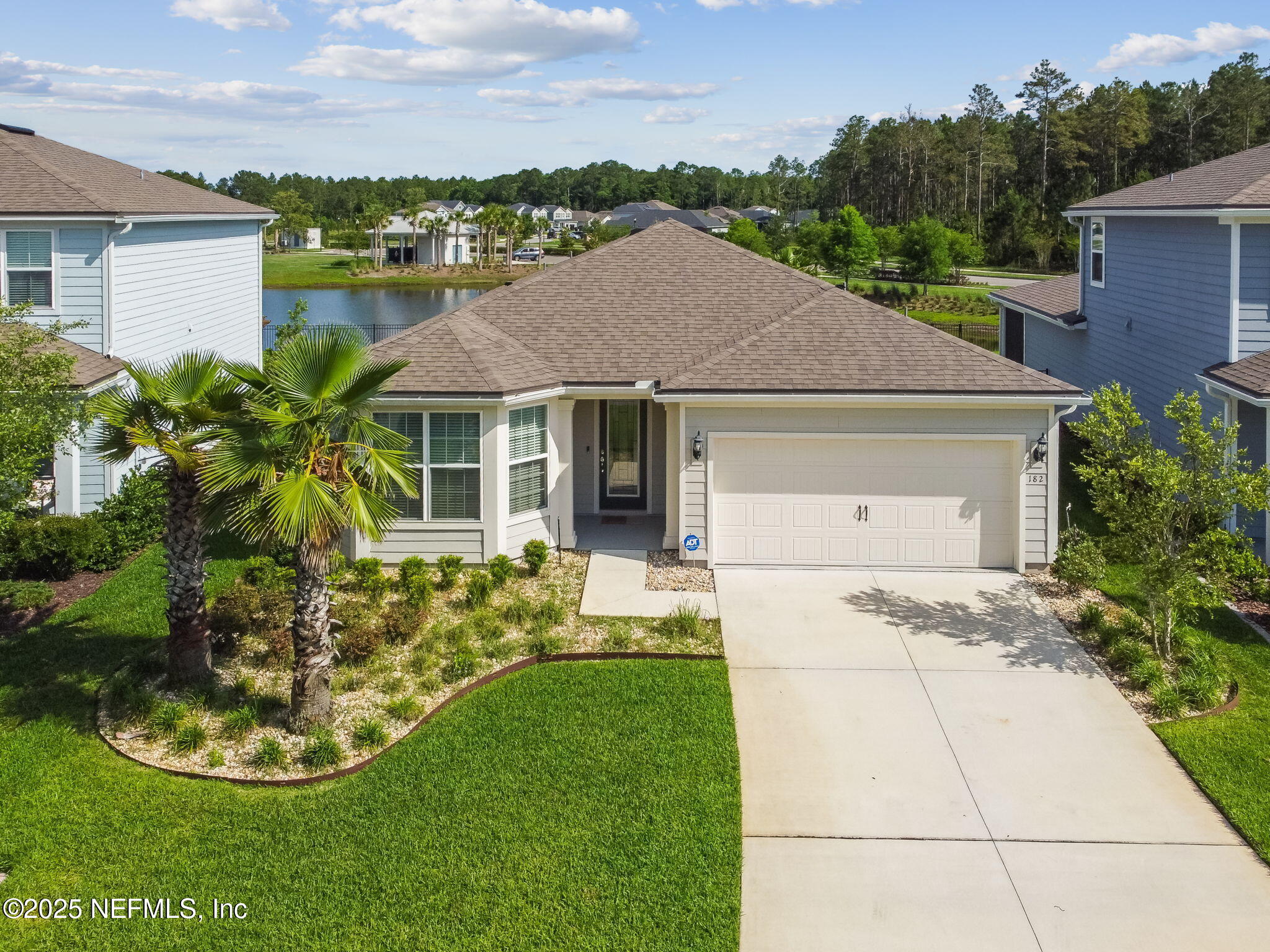 182 Myrtle Oak Court St. Augustine, FL 32092 - Photo 80 of 81 a aerial view of a house with a yard and potted plants