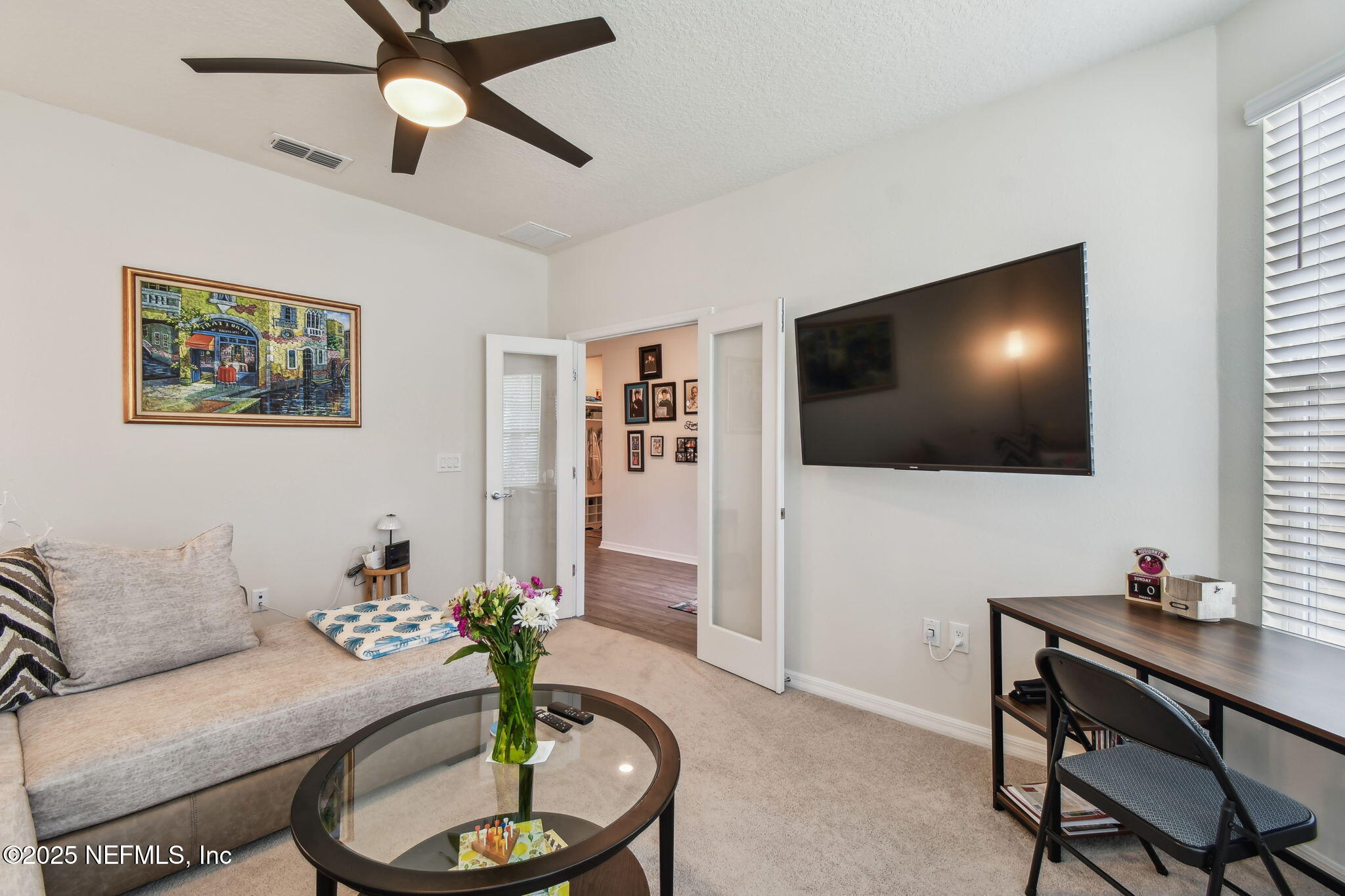 182 Myrtle Oak Court St. Augustine, FL 32092 - Photo 8 of 81 a living room with furniture and a flat screen tv