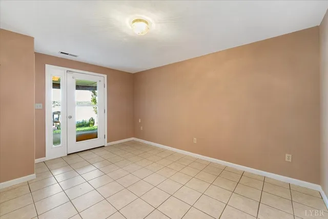 an empty room with fireplace