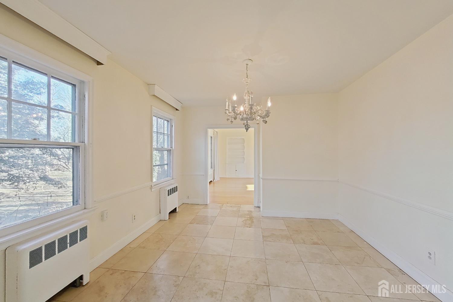 205 Ashland Road Middlesex, NJ 08846 - Photo 12 of 48 a view of an empty room with a window