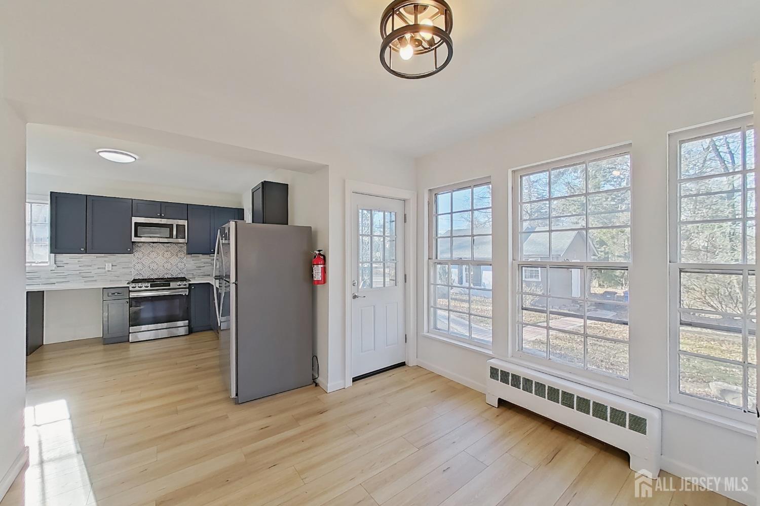 205 Ashland Road Middlesex, NJ 08846 - Photo 16 of 48 a view of kitchen with furniture and wooden floor