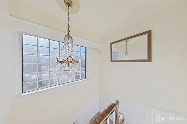 a kitchen with granite countertop a sink a stove and cabinets