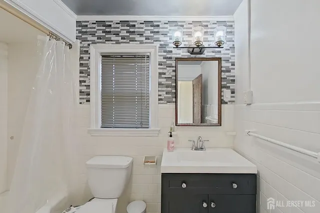 a kitchen with a refrigerator stove and microwave