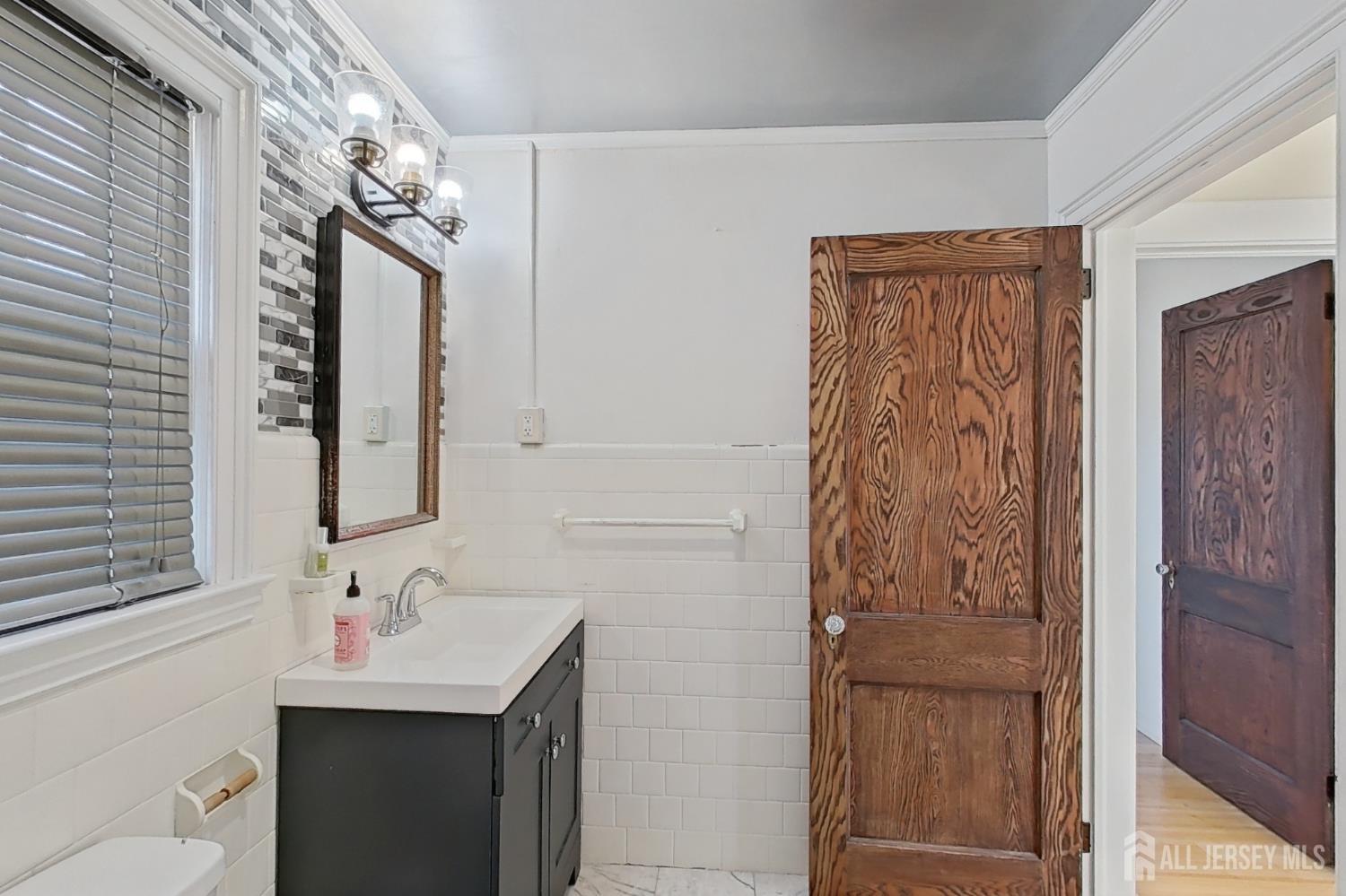 205 Ashland Road Middlesex, NJ 08846 - Photo 26 of 48 a bathroom with a sink vanity and a mirror