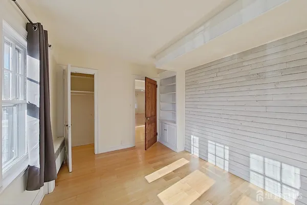 a view of livingroom with hardwood floor and staircase