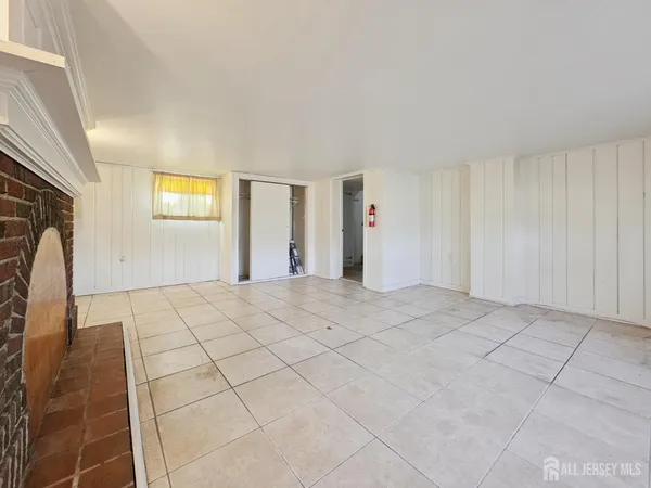 a view of entryway and gallery with wooden floor