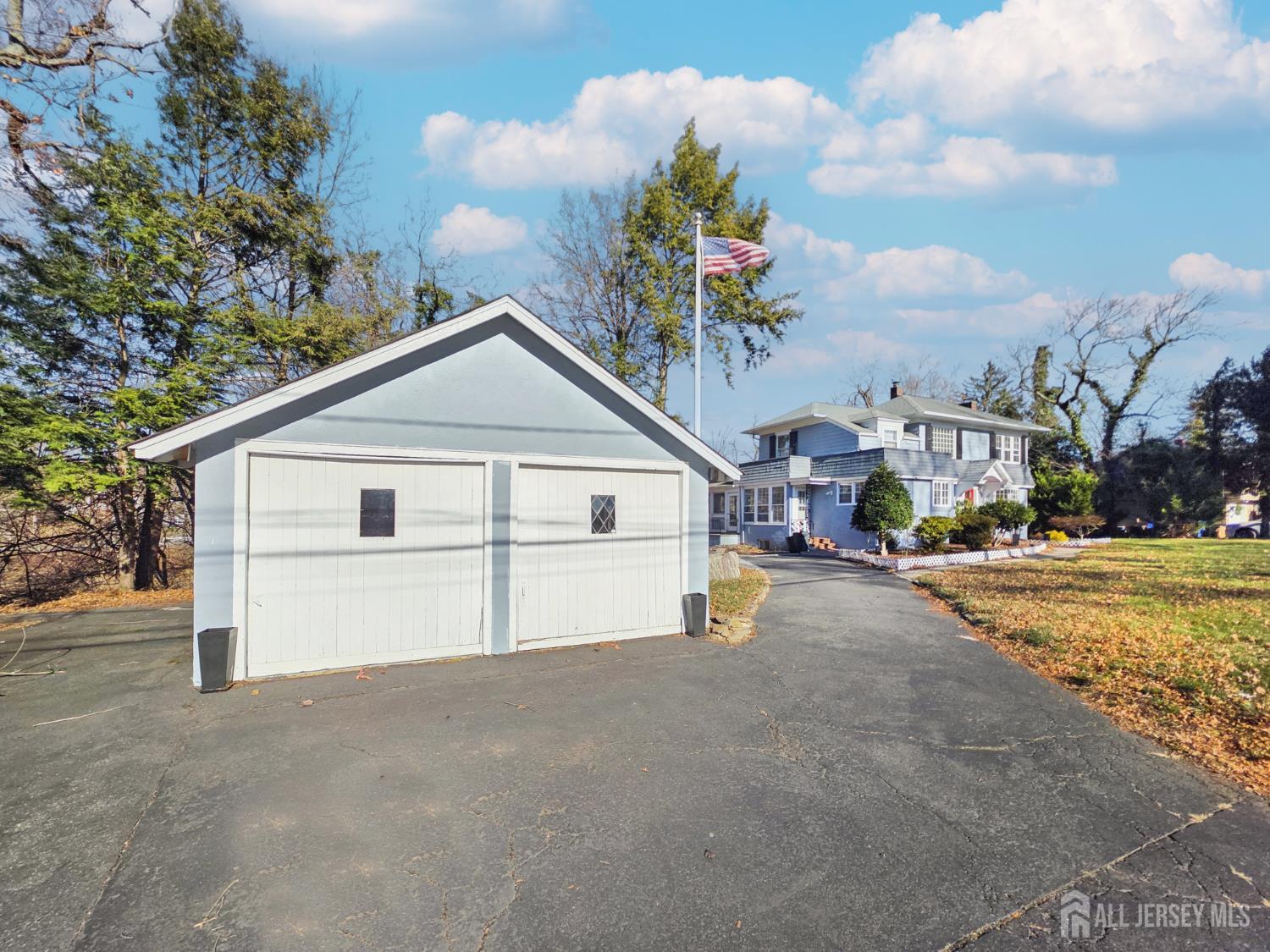 205 Ashland Road Middlesex, NJ 08846 - Photo 4 of 48 a view of a house with a yard and garage
