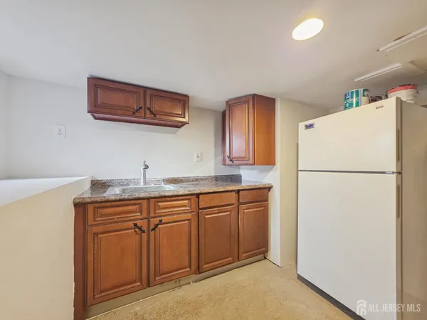 a kitchen with a refrigerator stove and microwave
