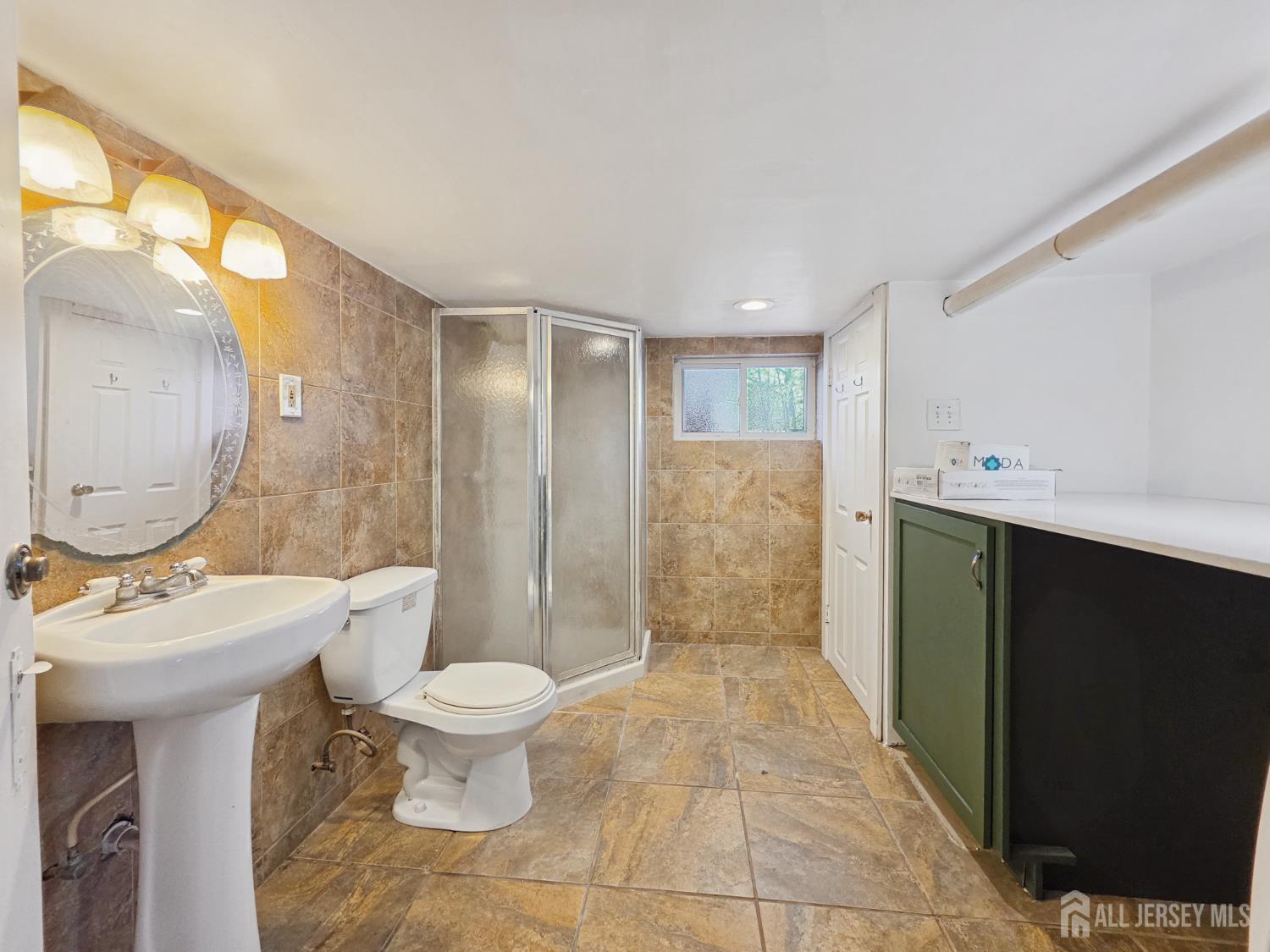 205 Ashland Road Middlesex, NJ 08846 - Photo 46 of 48 a bathroom with a toilet sink and mirror