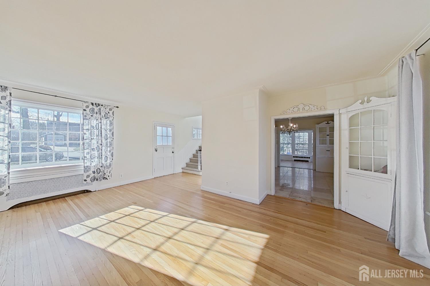 205 Ashland Road Middlesex, NJ 08846 - Photo 9 of 48 wooden floor in an empty room with a window
