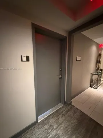 a bedroom with a bed and a mirror