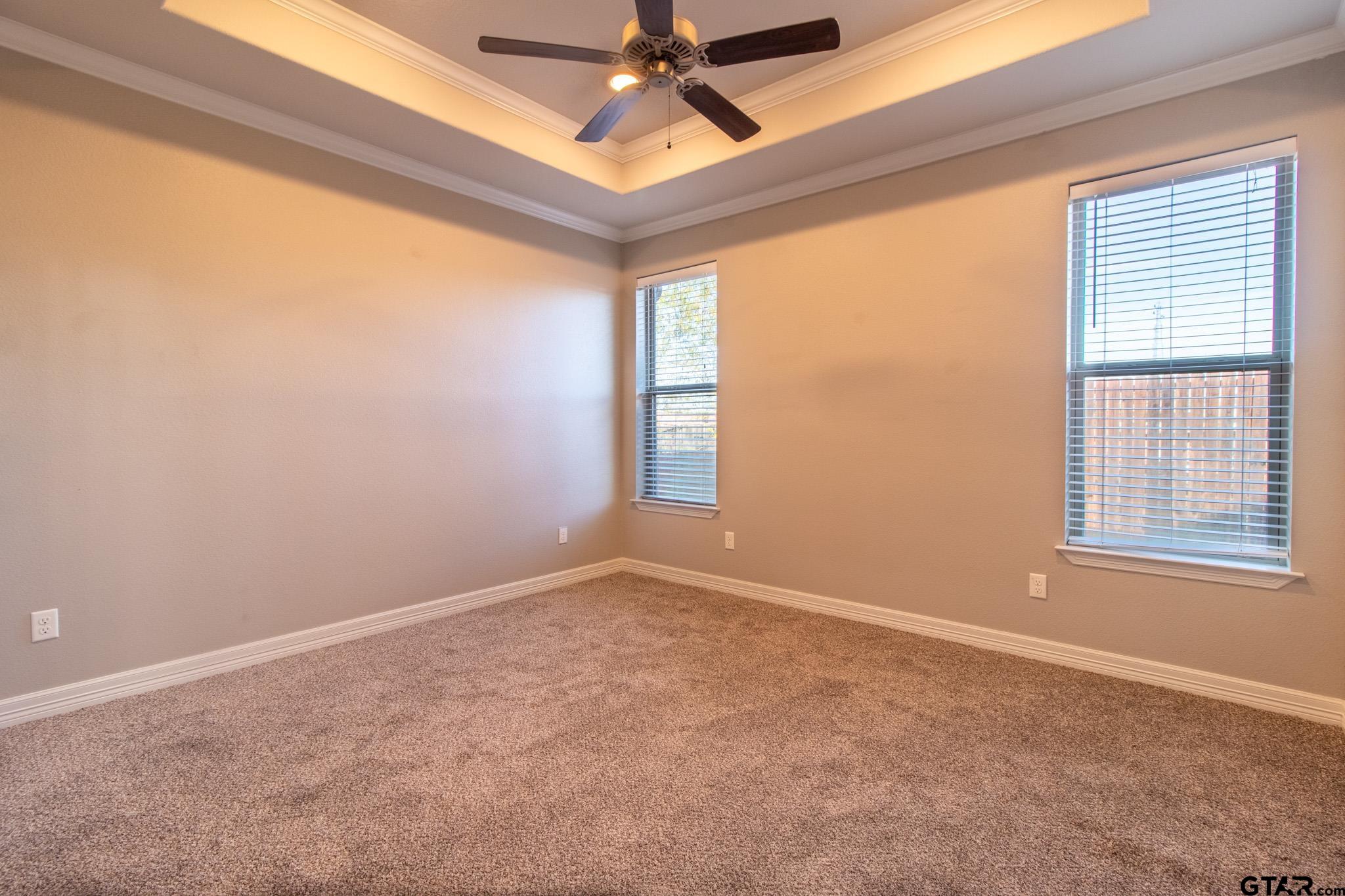 2806 Valley View Street Tyler, TX 75701 - Photo 11 of 22 an empty room with windows and fan