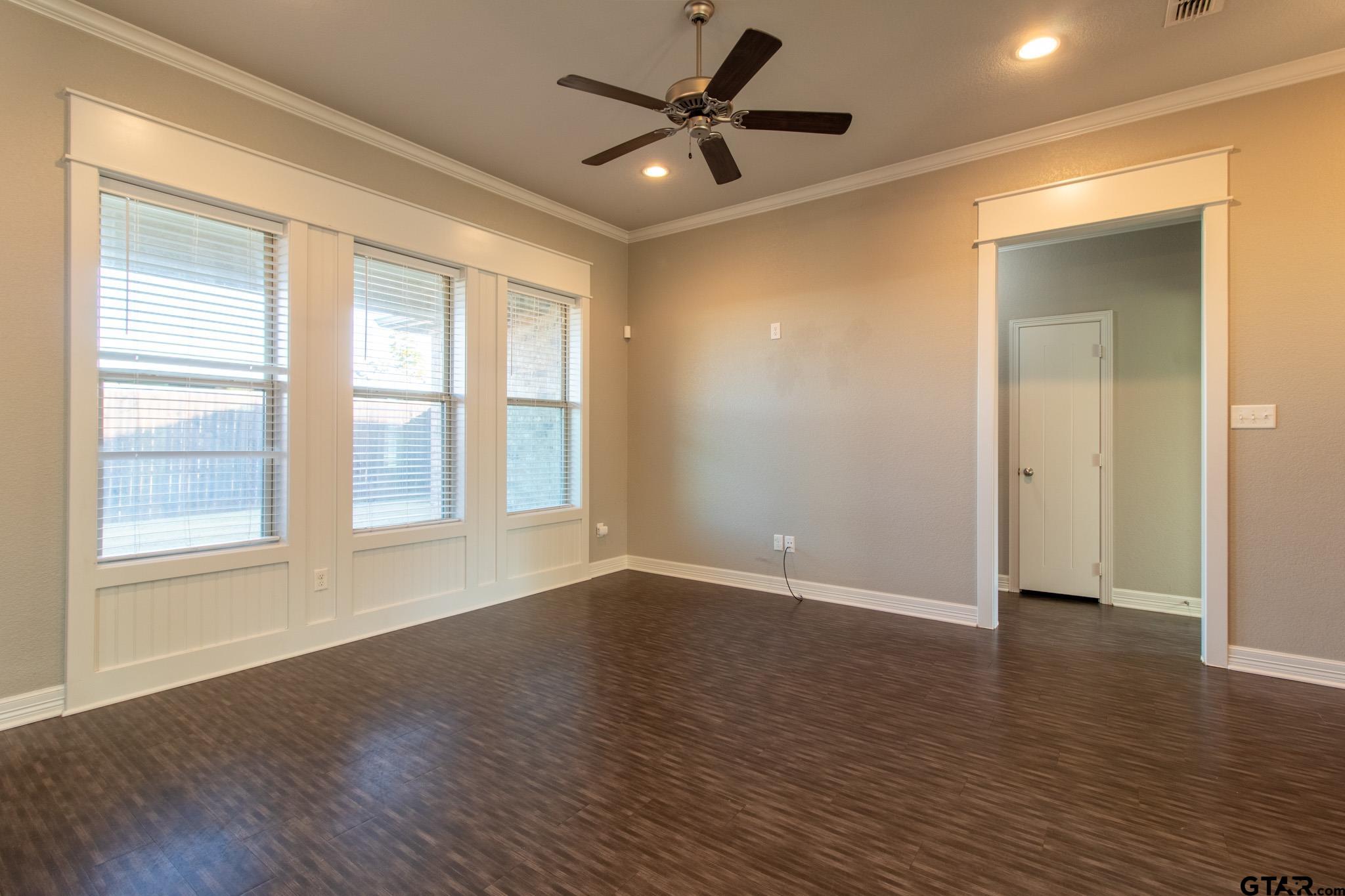 2806 Valley View Street Tyler, TX 75701 - Photo 5 of 22 a view of an empty room with window and wooden floor