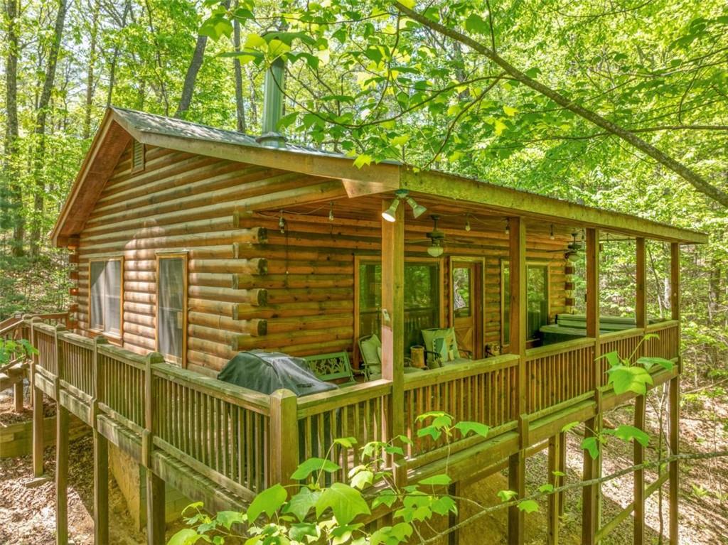 a view of an house with a small deck