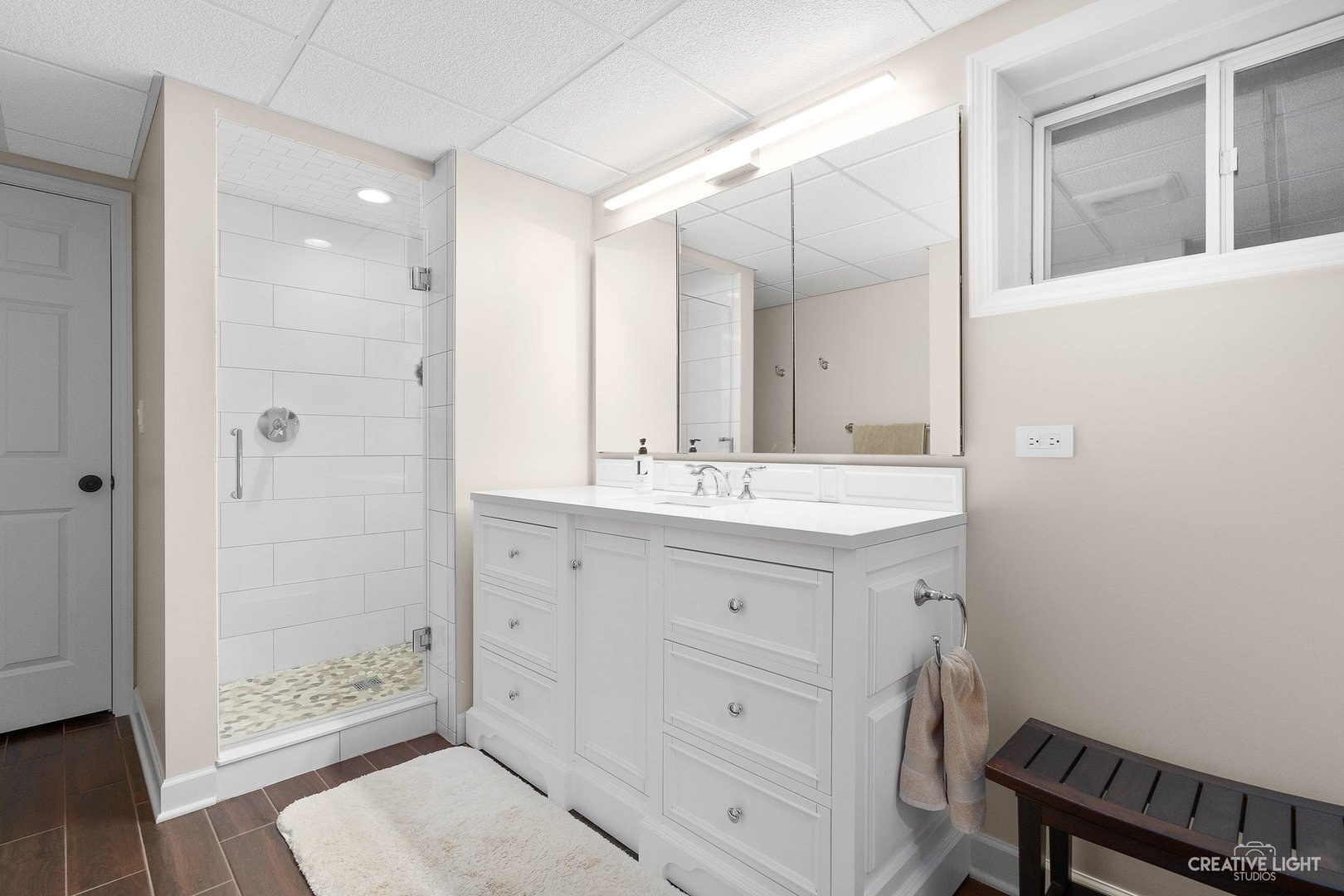 10 Aintree Road St. Charles, IL 60174 - Photo 24 of 34 a bathroom with a shower sink and mirror
