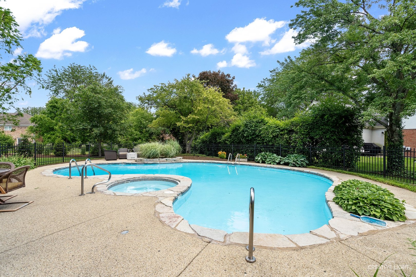 10 Aintree Road St. Charles, IL 60174 - Photo 27 of 34 a view of a swimming pool with a yard and plants