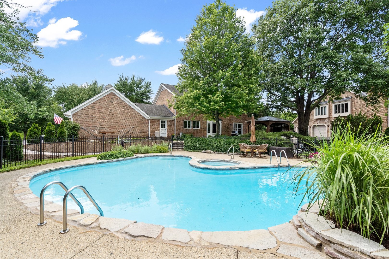 10 Aintree Road St. Charles, IL 60174 - Photo 28 of 34 a view of a house with swimming pool and sitting area