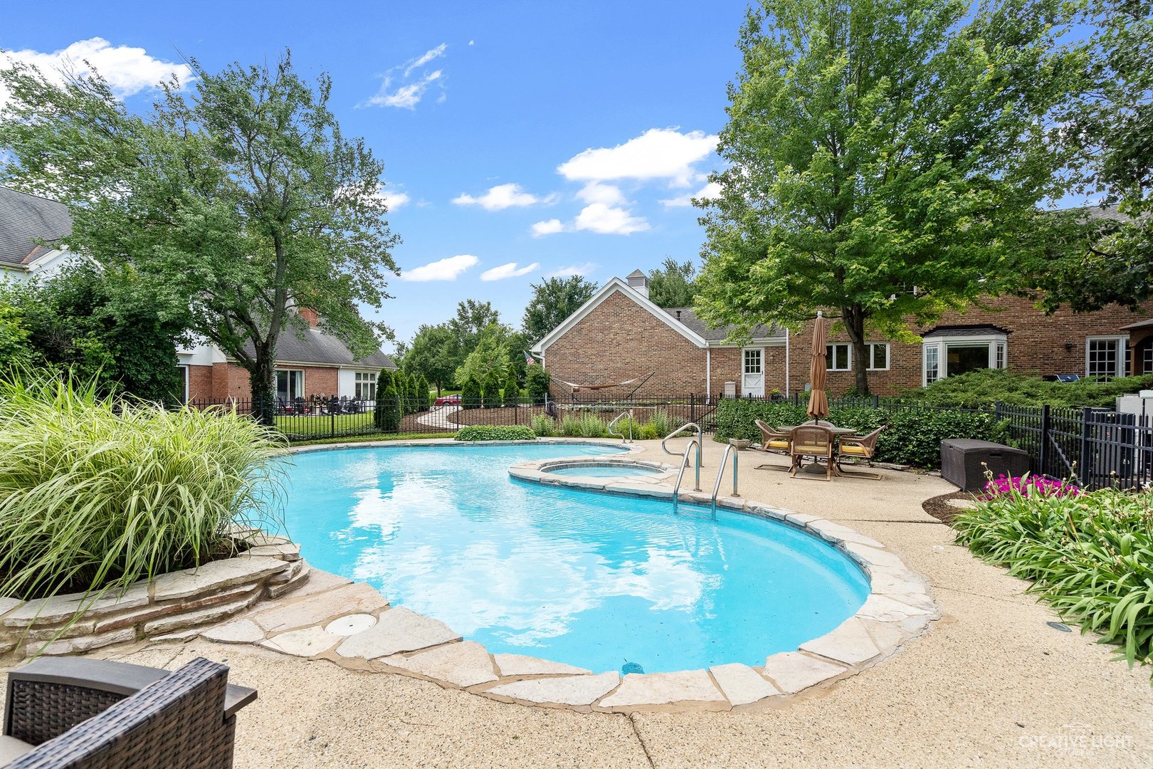 10 Aintree Road St. Charles, IL 60174 - Photo 29 of 34 a view of a house with swimming pool and sitting area