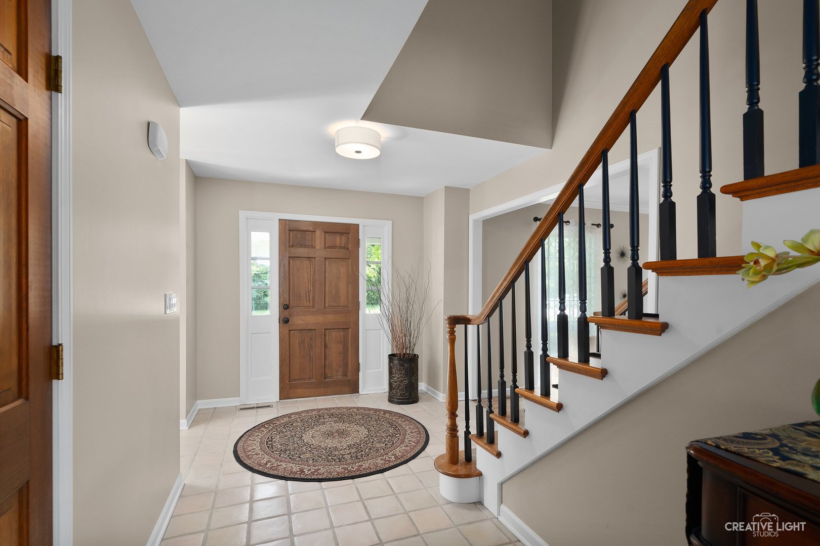 10 Aintree Road St. Charles, IL 60174 - Photo 5 of 34 a view of entryway with wooden floor and stairs