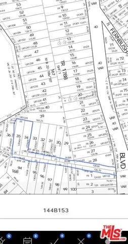 a front view of a building with parking area