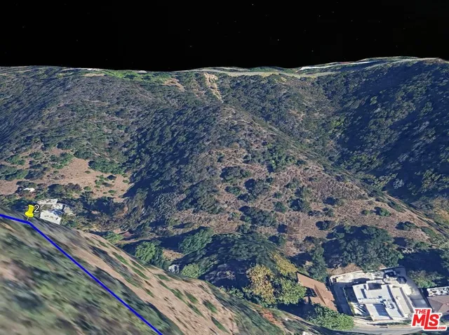 a street sign that is on a rock