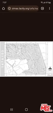 a view of a chairs and table in backyard