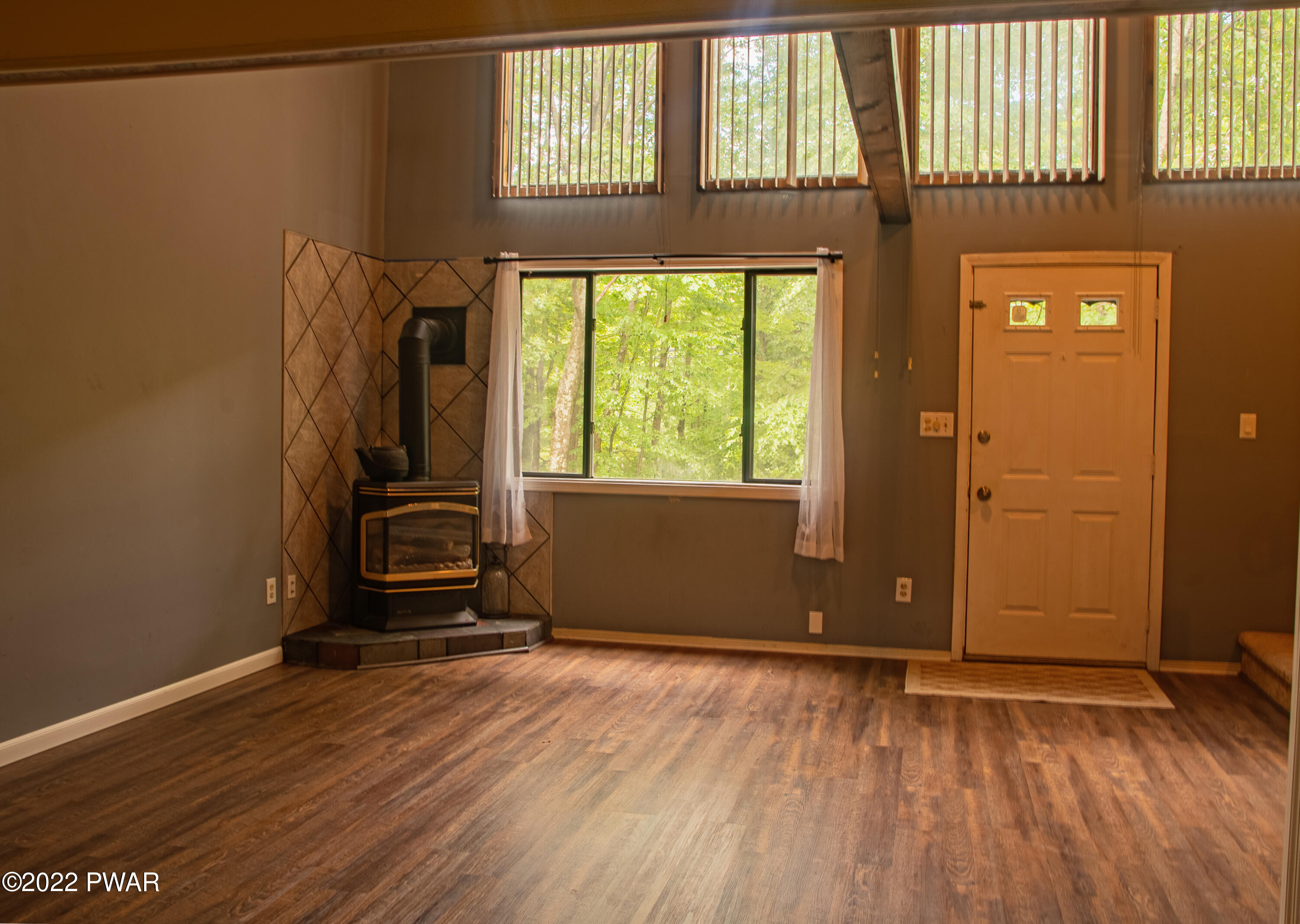 375 Mallard Lane Bushkill, PA 18324 - Photo 5 of 28 an empty room with wooden floor and windows