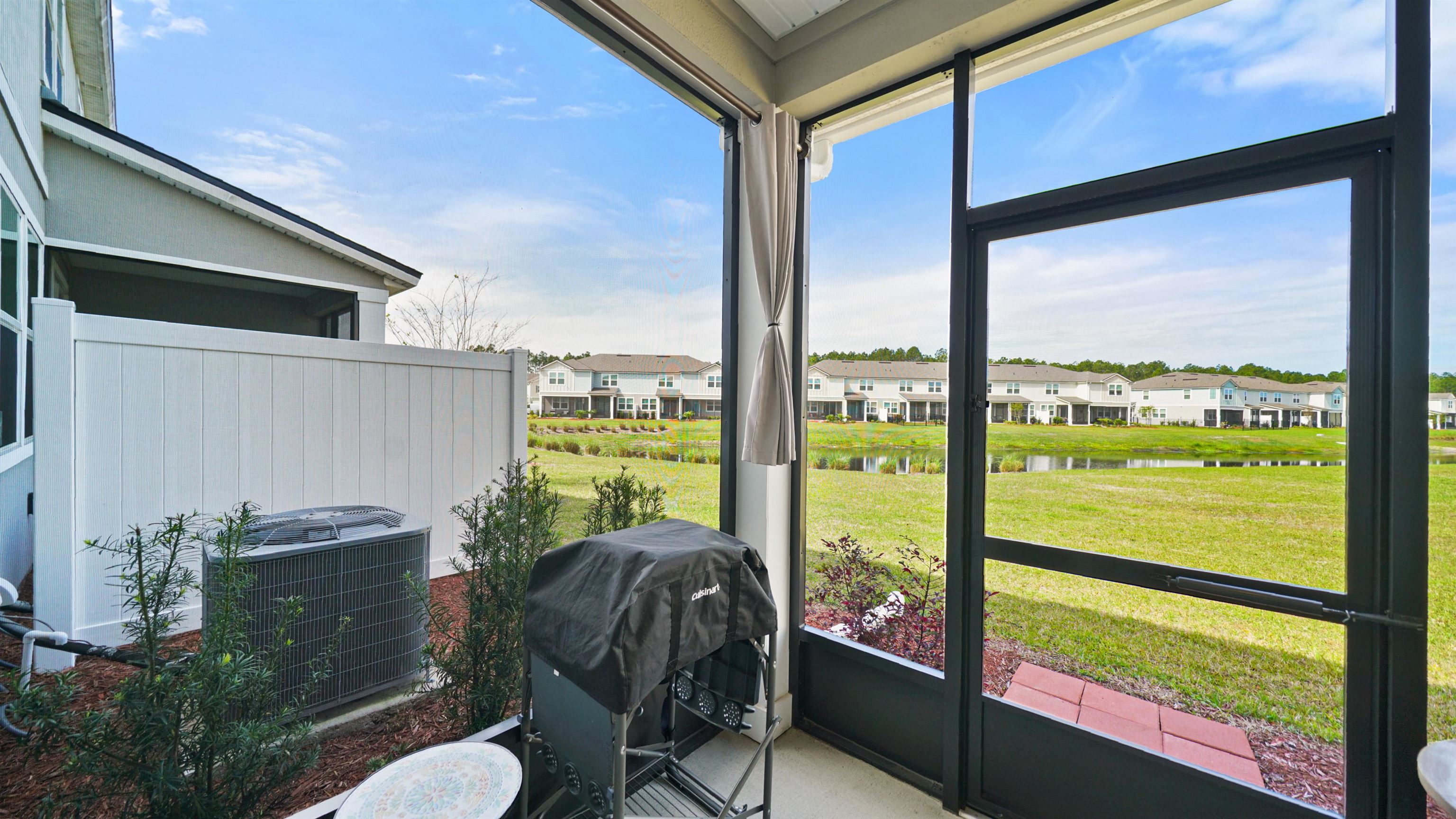 194 Redbud Road Palm Coast, FL 32137 - Photo 12 of 34 a view of a porch with furniture and a yard