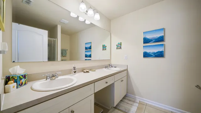 a bathroom with a sink a vanity and a mirror