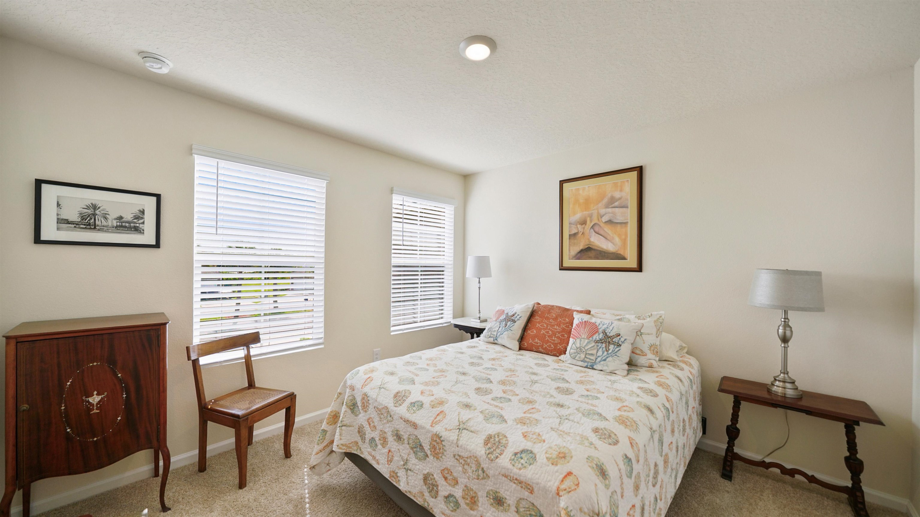194 Redbud Road Palm Coast, FL 32137 - Photo 18 of 34 a bedroom with a bed and wooden floor