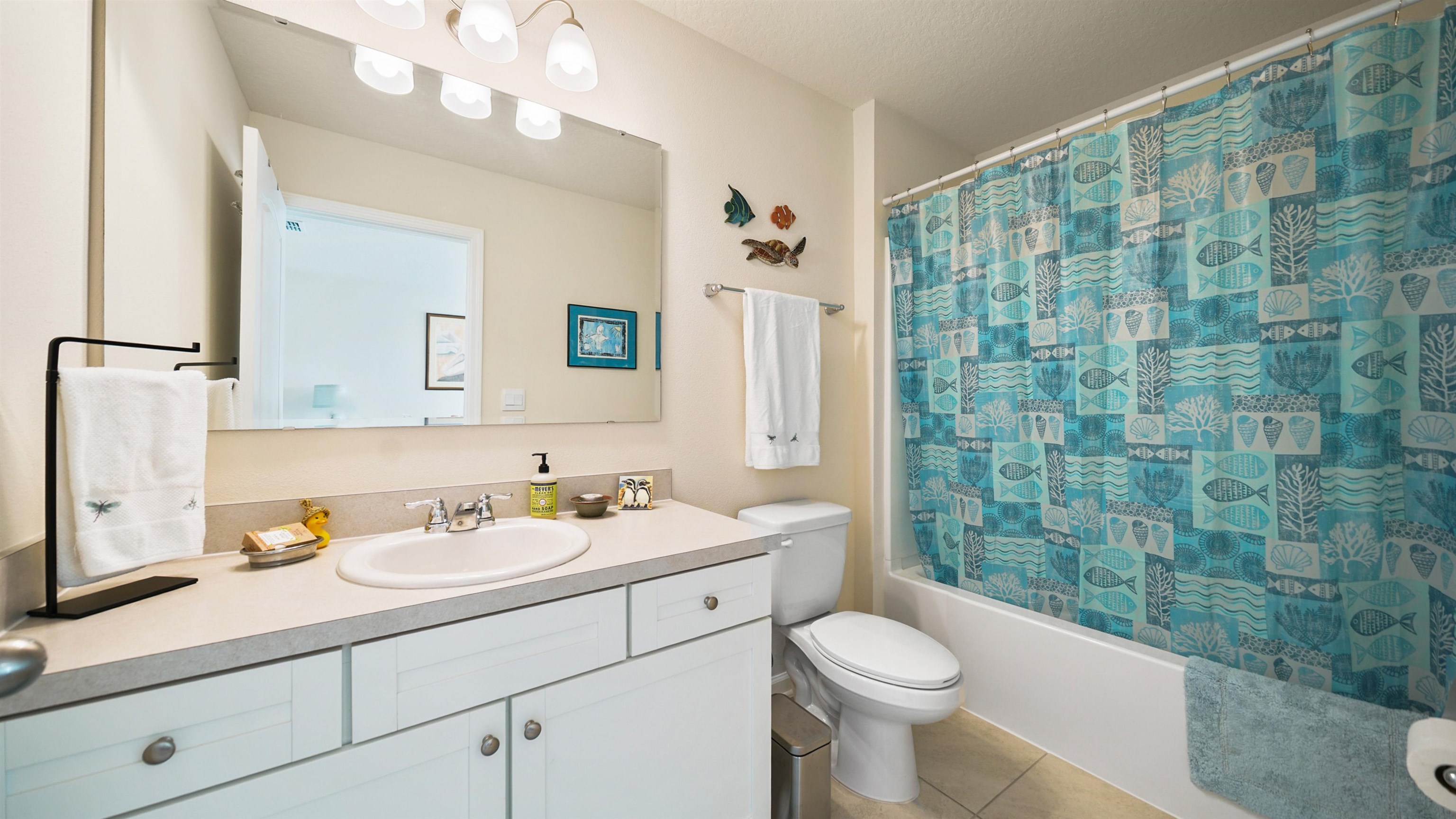 194 Redbud Road Palm Coast, FL 32137 - Photo 20 of 34 a bathroom with a sink a toilet and shower