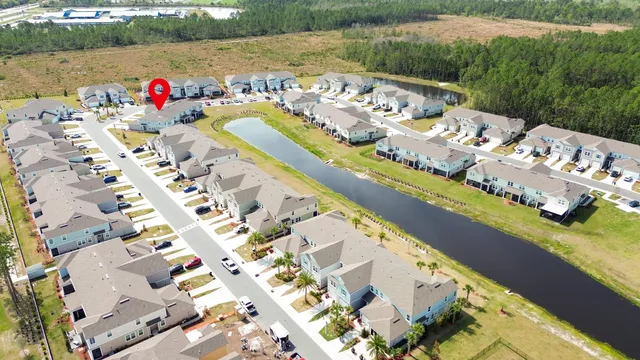an aerial view of house with yard