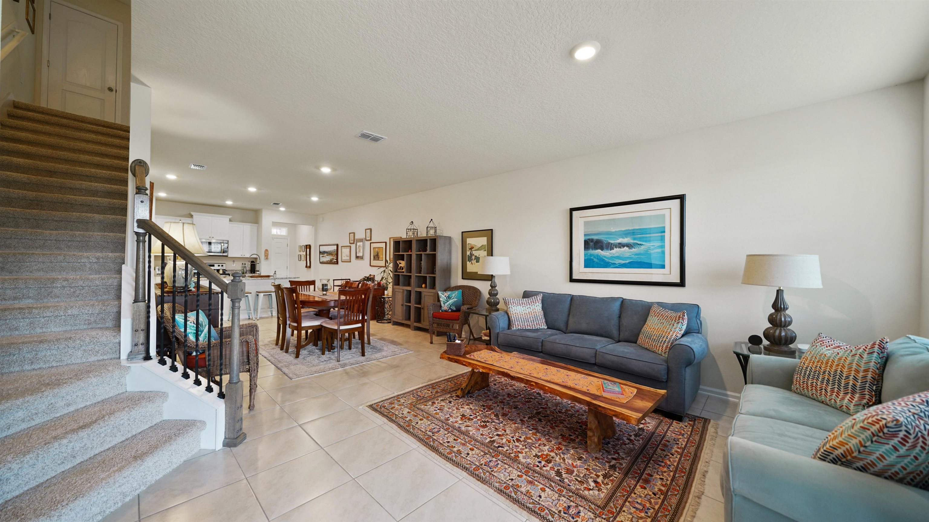 194 Redbud Road Palm Coast, FL 32137 - Photo 7 of 34 a living room with furniture and a rug