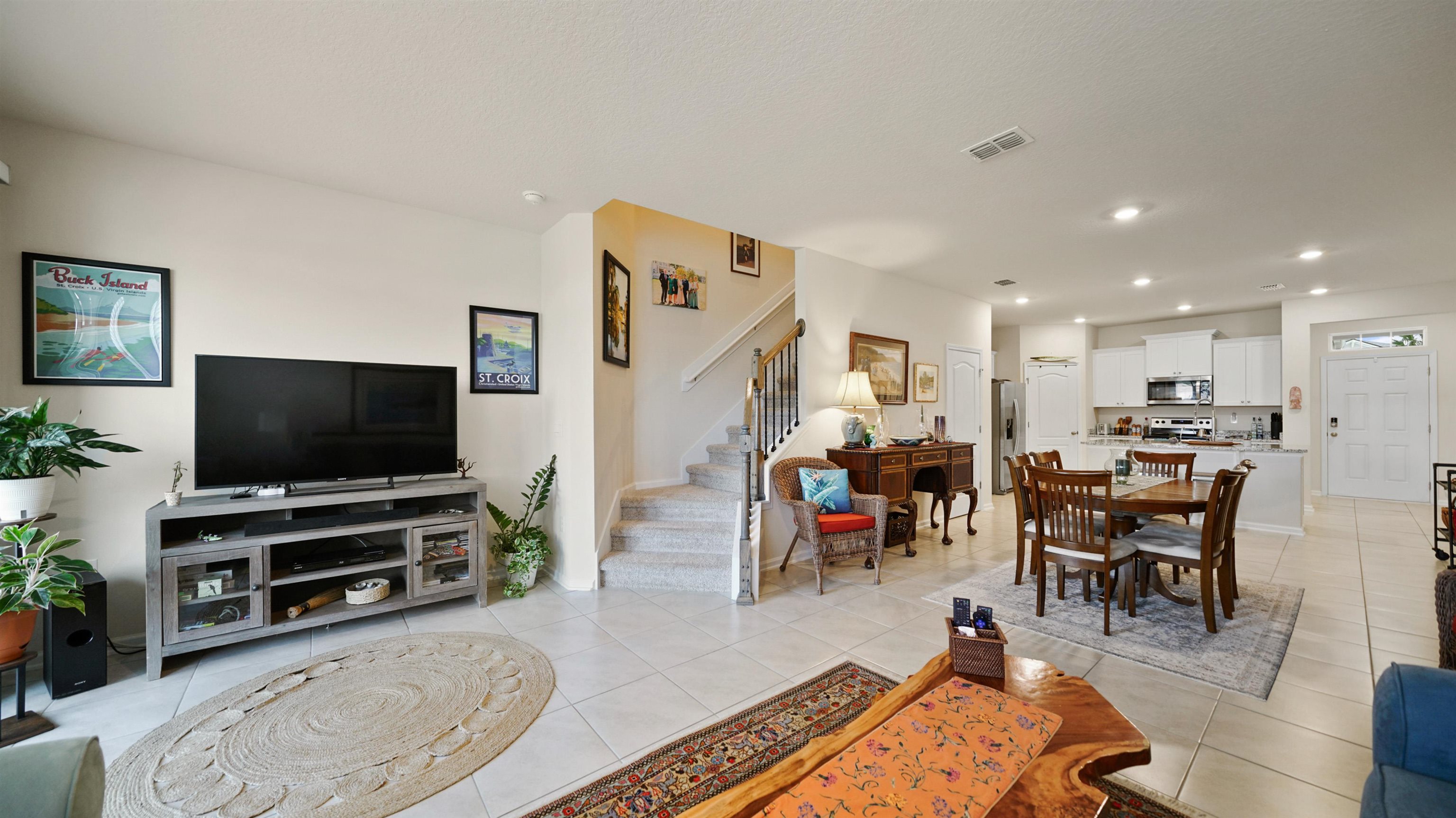 194 Redbud Road Palm Coast, FL 32137 - Photo 8 of 34 a living room with furniture and a flat screen tv