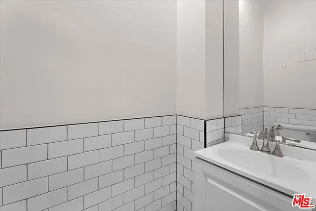 a bathroom with a sink and a shower curtain