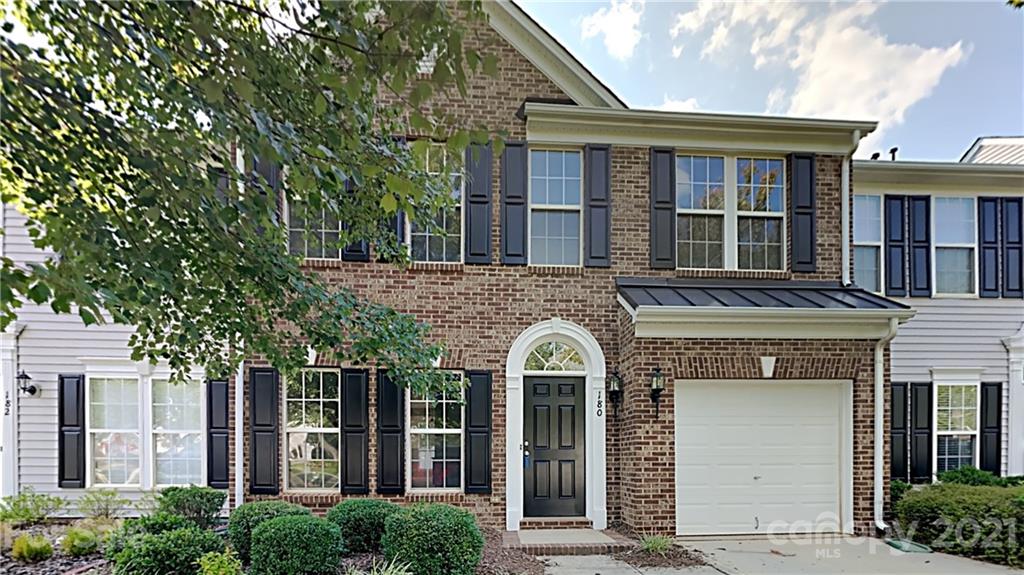 180 Snead Road Fort Mill, SC 29715 - Photo 1 of 15 front view of a brick house with a small yard