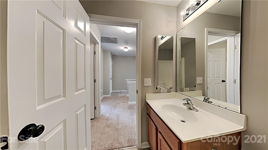 180 Snead Road Fort Mill, SC 29715 - Photo 14 of 15 a bathroom with a sink double vanity and a mirror