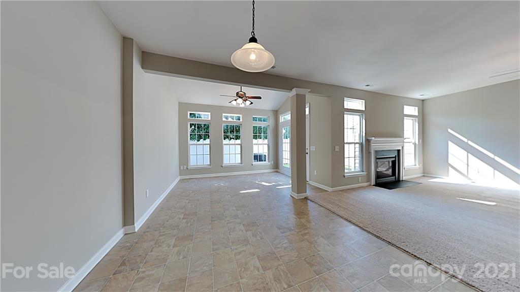 180 Snead Road Fort Mill, SC 29715 - Photo 6 of 15 a view of a livingroom with furniture wooden floor and a window