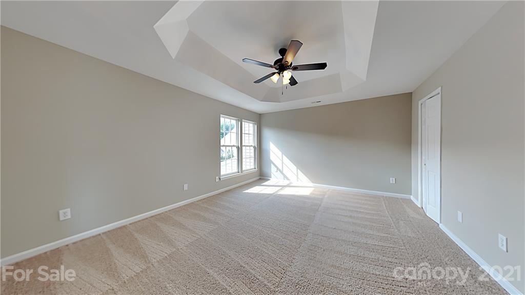 180 Snead Road Fort Mill, SC 29715 - Photo 10 of 15 a view of empty room with wooden floor and fan