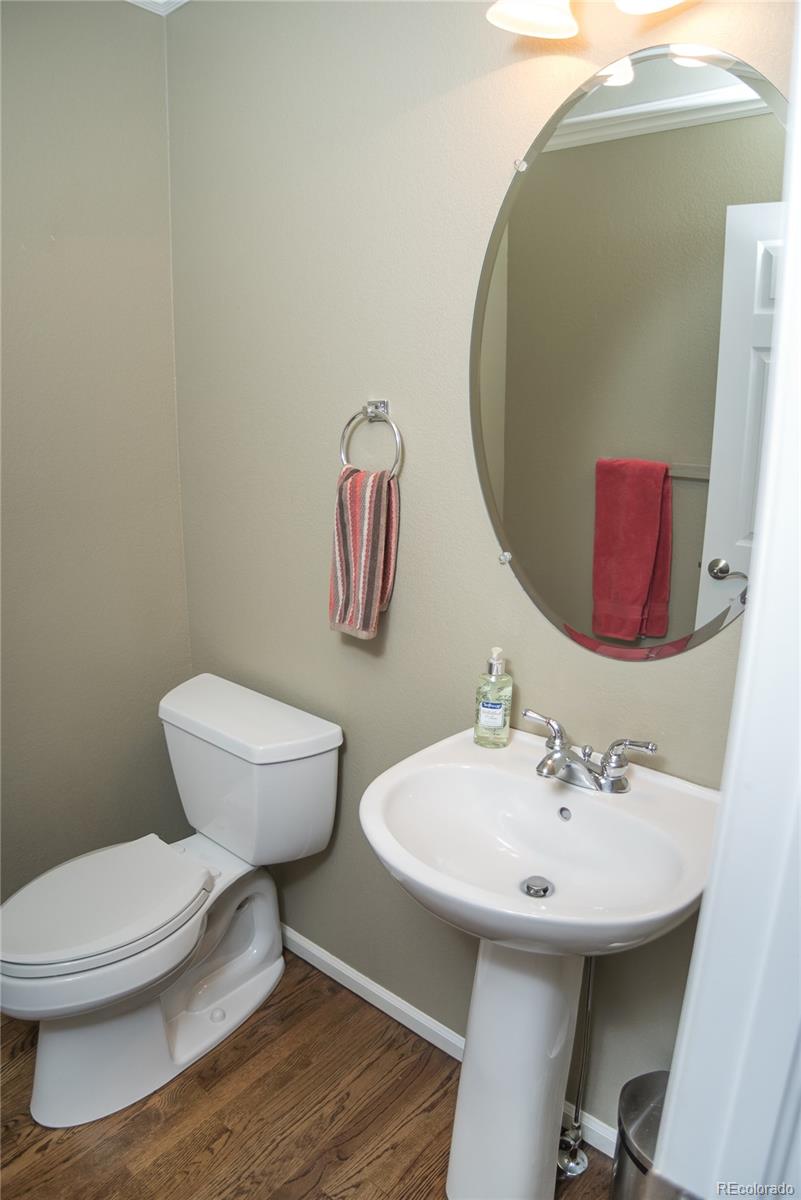 10221 South Nickolas Avenue Highlands Ranch, CO 80130 - Photo 14 of 35 a bathroom with a toilet and a sink
