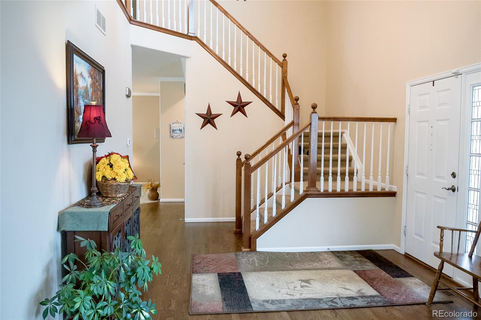 10221 South Nickolas Avenue Highlands Ranch, CO 80130 - Photo 15 of 35 a view of entryway with wooden floor